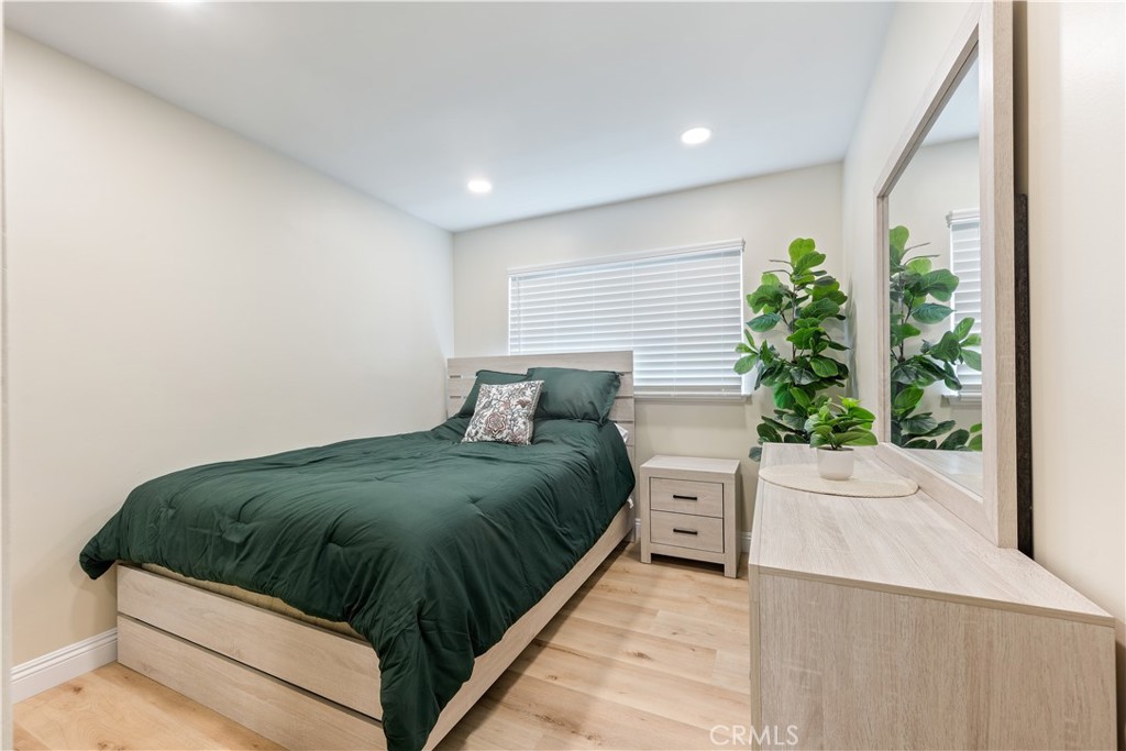 20151 Big Bend Lane Huntington Beach, CA 92646 - Photo 14 of 28 a bed sitting in a spacious bedroom next to a window