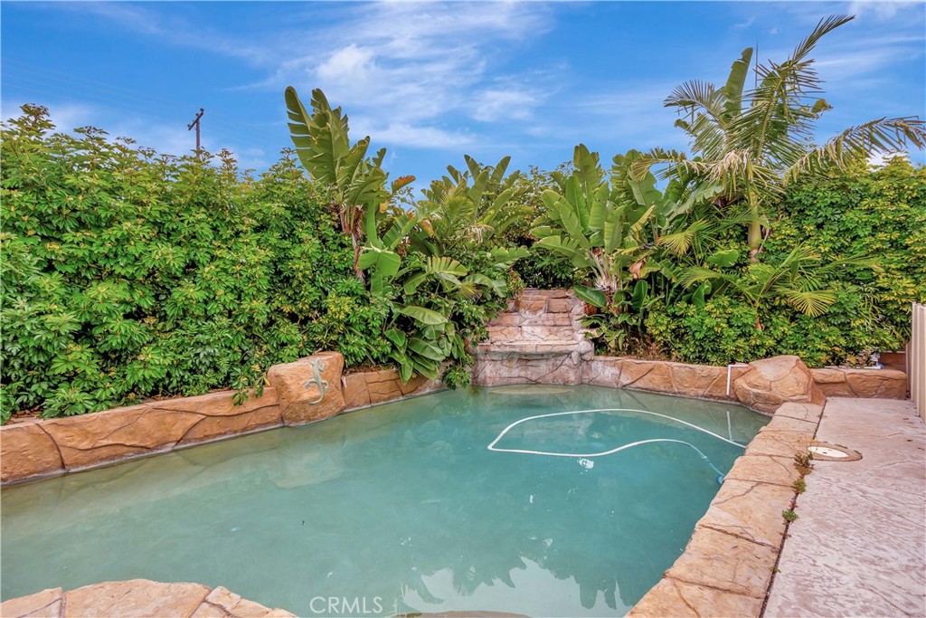 20151 Big Bend Lane Huntington Beach, CA 92646 - Photo 19 of 28 a view of a backyard with plants and a patio