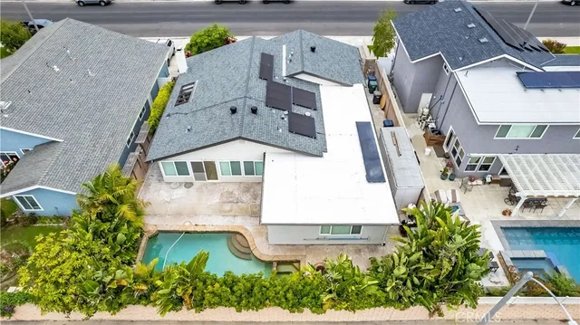 an aerial view of residential houses with outdoor space