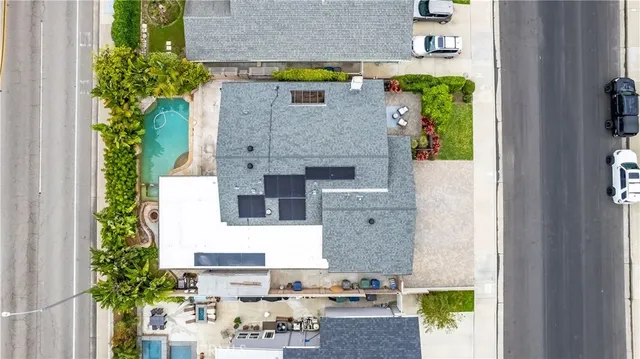 an aerial view of a house with outdoor space
