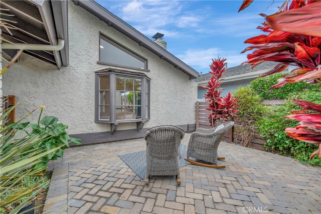 20151 Big Bend Lane Huntington Beach, CA 92646 - Photo 5 of 28 a view of a chair and table in backyard of the house
