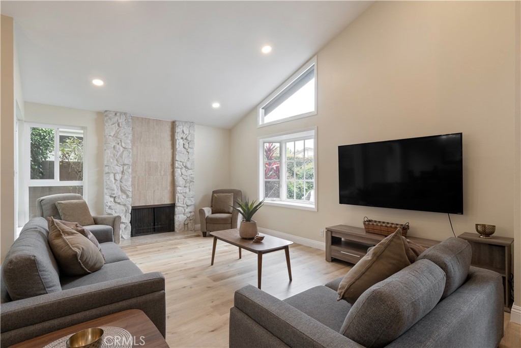 20151 Big Bend Lane Huntington Beach, CA 92646 - Photo 7 of 28 a living room with furniture and a flat screen tv