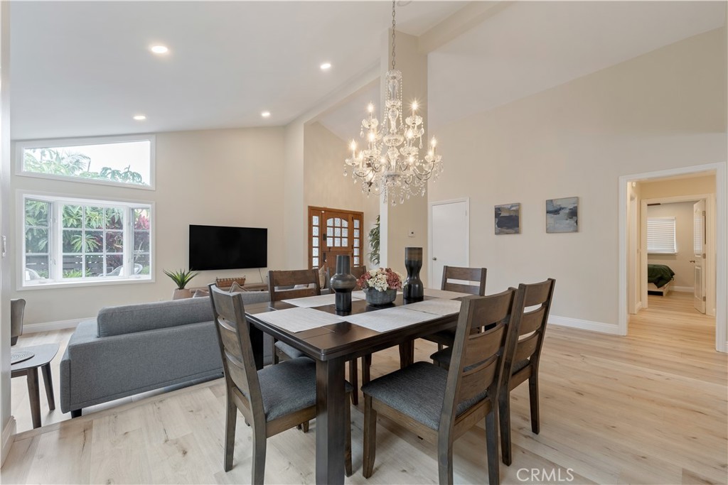 20151 Big Bend Lane Huntington Beach, CA 92646 - Photo 8 of 28 a view of a dining room with furniture window and wooden floor