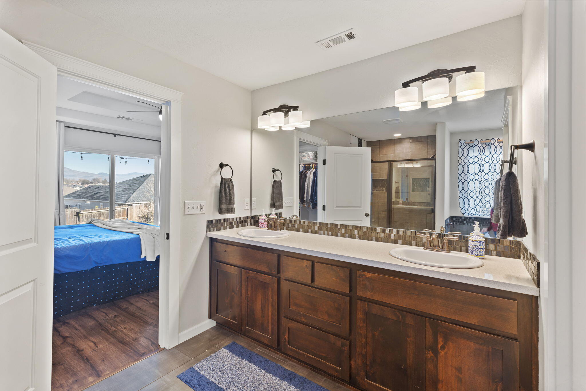 110 Linton Way Eagle Point, OR 97524 - Photo 14 of 41 a bathroom with a double vanity sink and a mirror