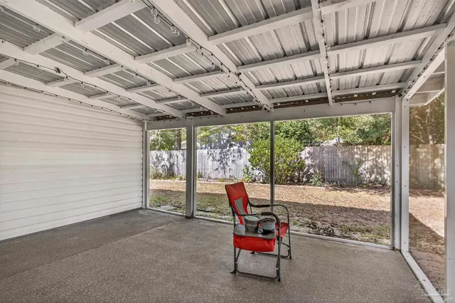 a outdoor space with patio lots of furniture and iron fence
