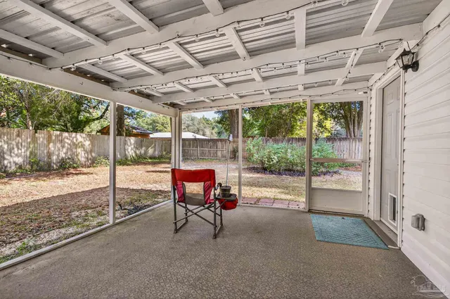 a view of a room with wooden walls