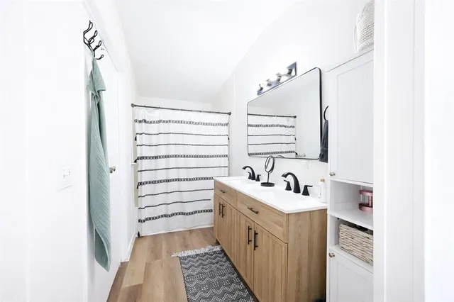 a bathroom with a sink and a mirror