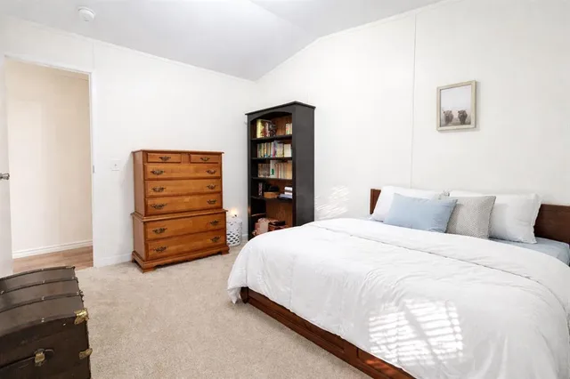 a bedroom with a bed and furniture