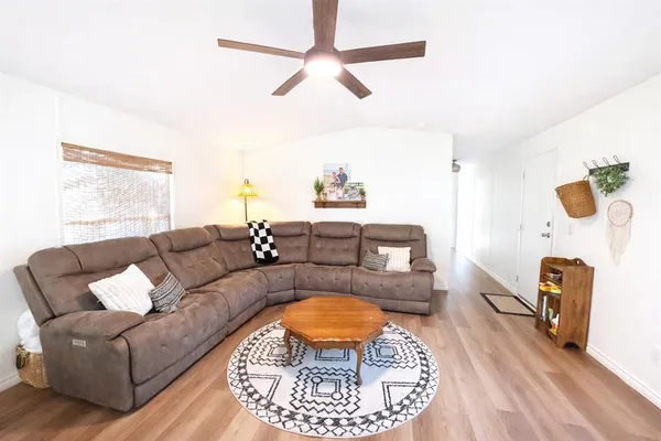 a living room with furniture and a rug