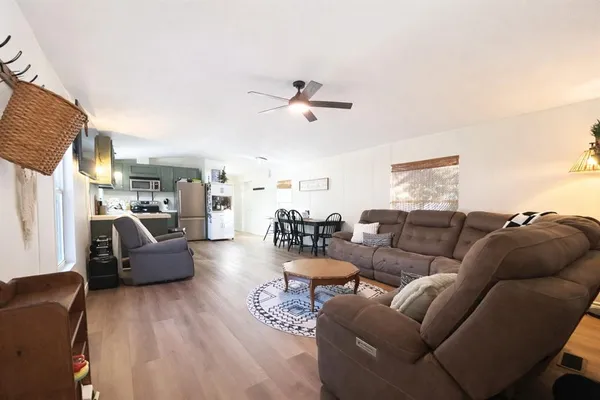 a living room with furniture or couch and a chandelier