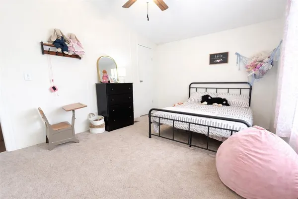 a bedroom with furniture and a bed