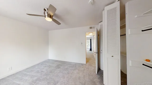 a view of a livingroom and a hallway