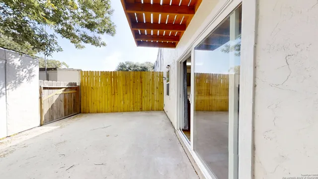 a view of a porch with a refrigerator