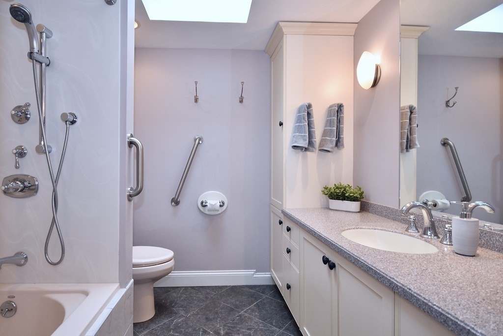 186 Sheaffer Road Barnstable, MA 02632 - Photo 23 of 29 a bathroom with a granite countertop sink toilet and shower
