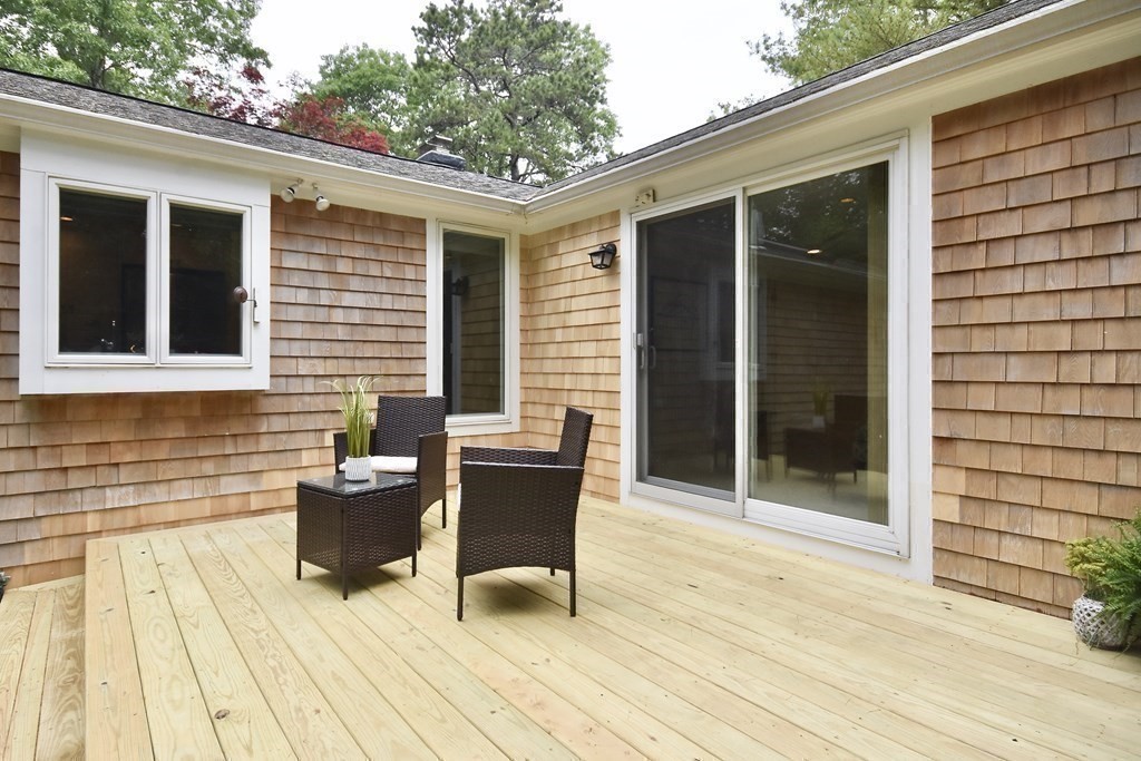 186 Sheaffer Road Barnstable, MA 02632 - Photo 26 of 29 a view of a house with backyard and sitting area