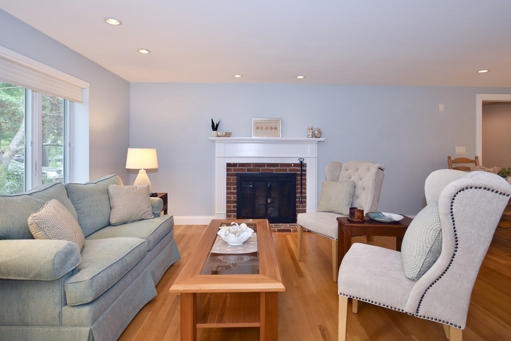 186 Sheaffer Road Barnstable, MA 02632 - Photo 6 of 29 a living room with furniture and a fireplace