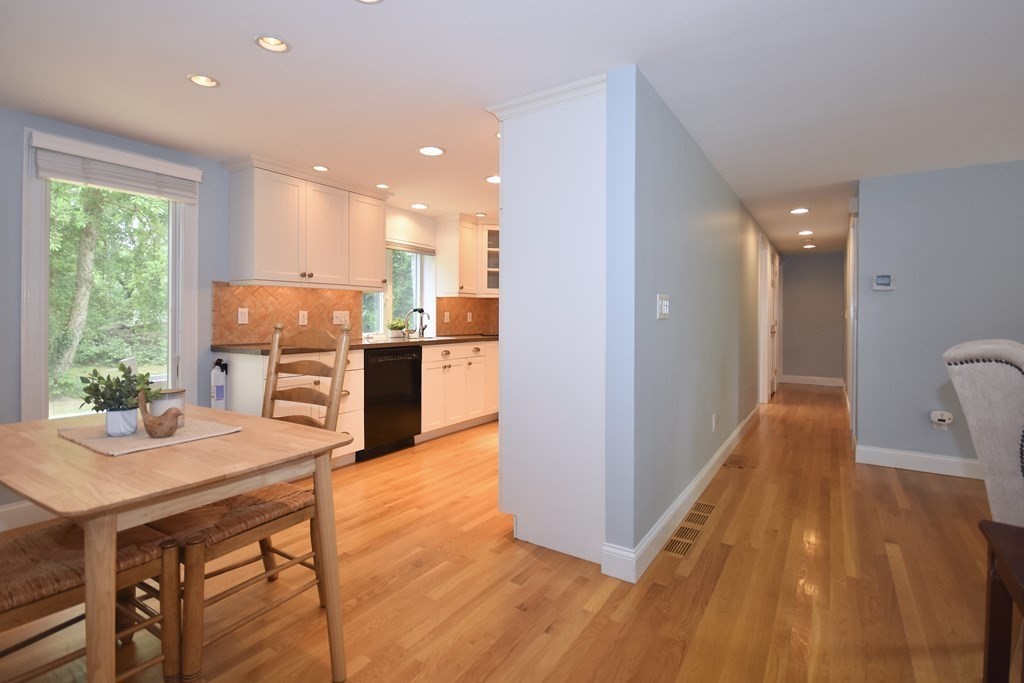 186 Sheaffer Road Barnstable, MA 02632 - Photo 8 of 29 a open kitchen with stainless steel appliances granite countertop a stove and a refrigerator