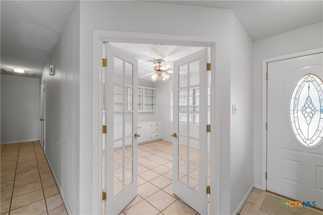 406 Blyth Road Victoria, TX 77904 - Photo 17 of 32 a bathroom with a glass shower door and a sink