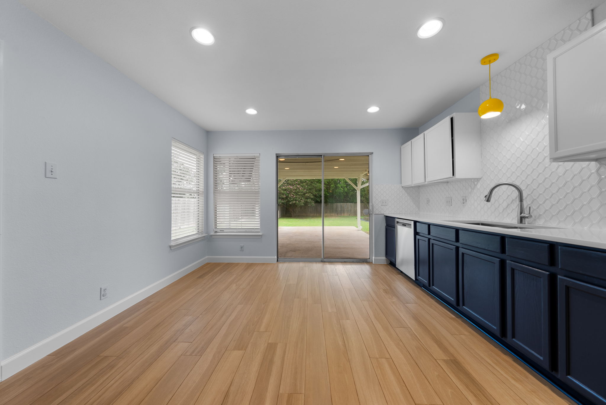 7327 Pusch Ridge Loop Austin, TX 78749 - Photo 11 of 26 A well-lit kitchen area with direct access to a spacious backyard patio.