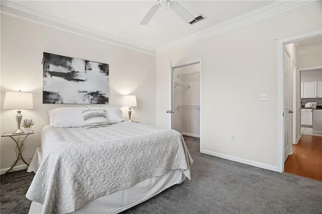 a bedroom with a bed and a lamp