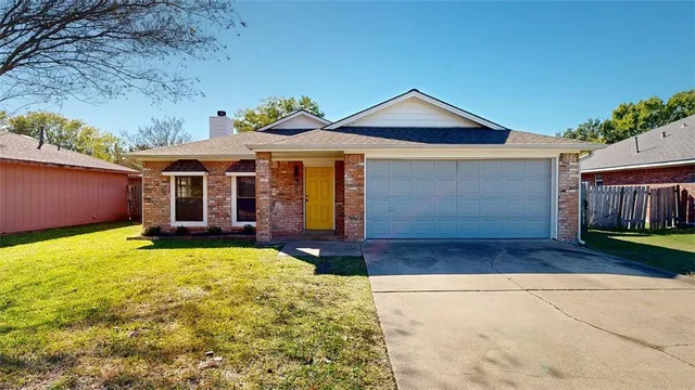 a front view of a house with yard