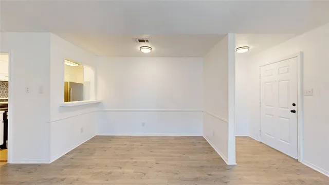 a kitchen with stainless steel appliances a stove a sink and a refrigerator
