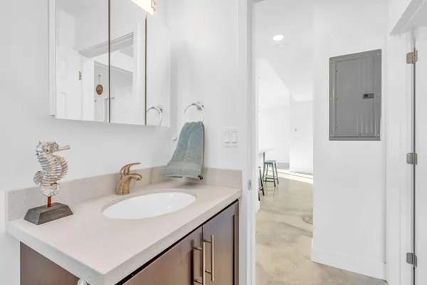 a bathroom with a sink and a mirror