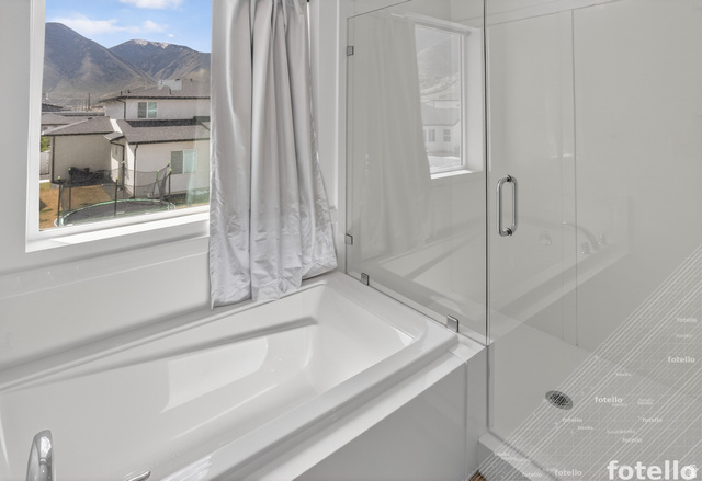 815 West Powderwood Lane Mapleton, UT 84664 - Photo 23 of 39 Bathroom with a garden tub, a shower stall, and a mountain view
