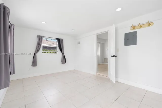 a view of a storage & utility room with a hallway