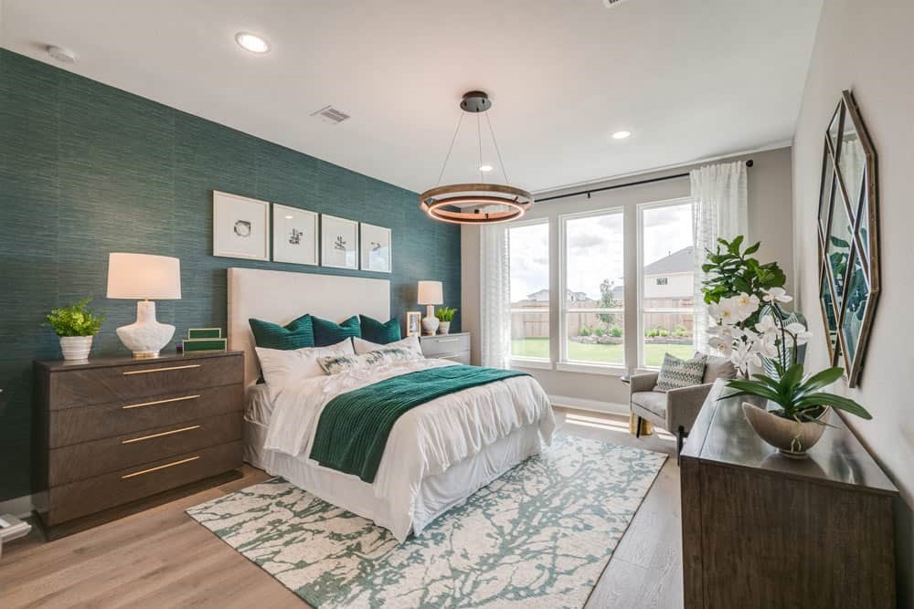 4811 Morning Spgs Drive Spring, TX 77386 - Photo 15 of 37 a bedroom with a large bed and a potted plant