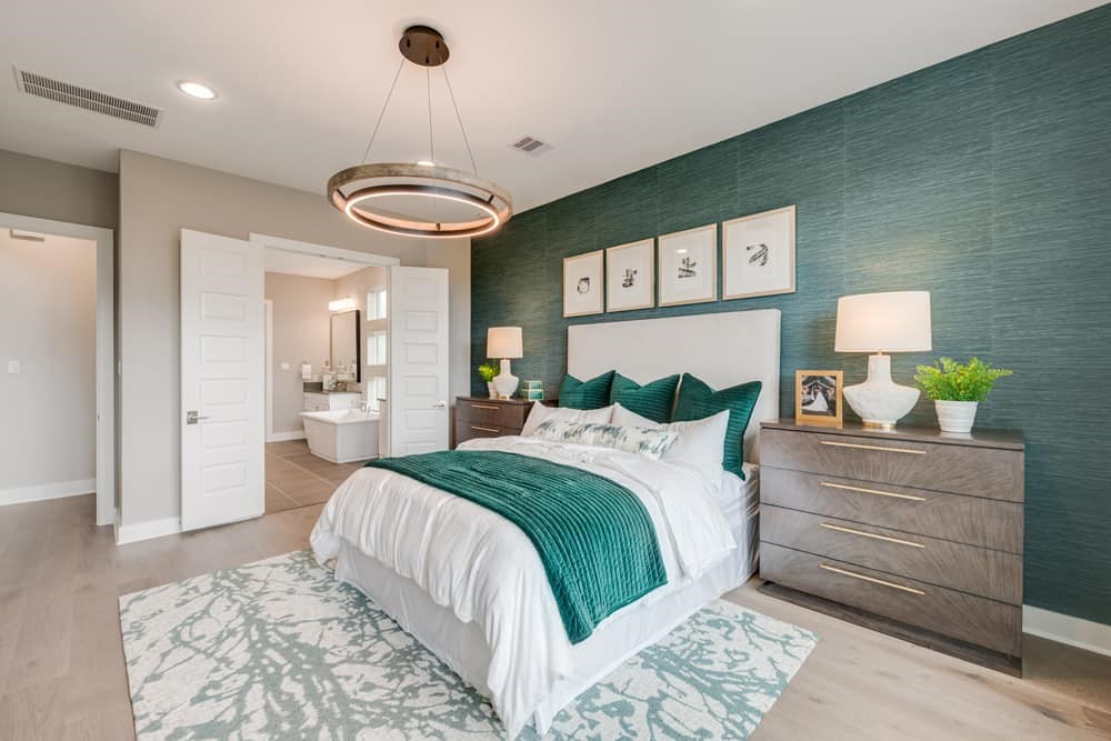 4811 Morning Spgs Drive Spring, TX 77386 - Photo 16 of 37 a bedroom with a bed and a chandelier