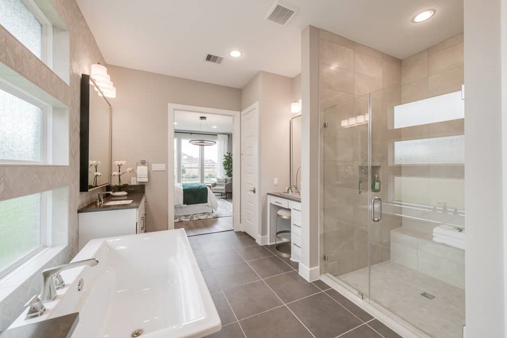 4811 Morning Spgs Drive Spring, TX 77386 - Photo 18 of 37 a bathroom with a tub a mirror and a shower