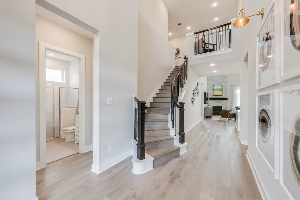 4811 Morning Spgs Drive Spring, TX 77386 - Photo 21 of 37 a view of a hallway view with staircase and kitchen view