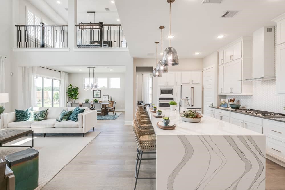 4811 Morning Spgs Drive Spring, TX 77386 - Photo 3 of 37 a large white kitchen with lots of counter space and chandelier