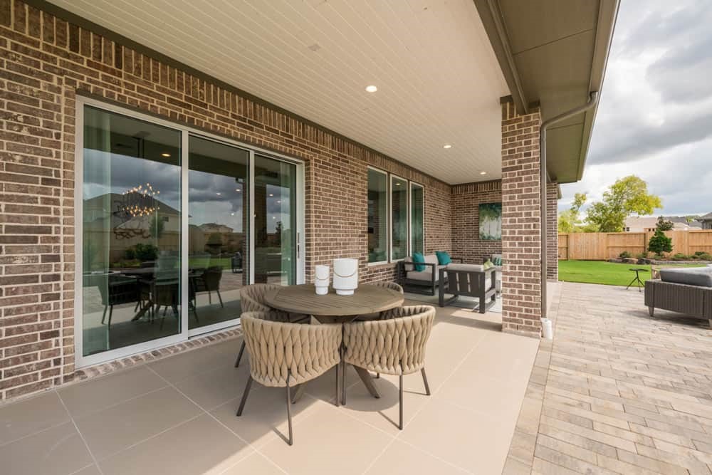 4811 Morning Spgs Drive Spring, TX 77386 - Photo 35 of 37 a outdoor space with patio the couches and a dining table with garden view