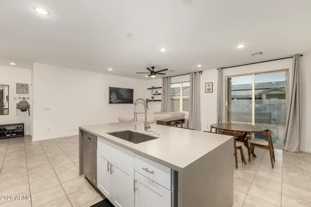 a kitchen with a sink a counter top space and appliances