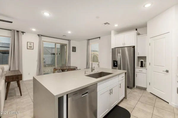 a kitchen with a refrigerator a sink and a refrigerator