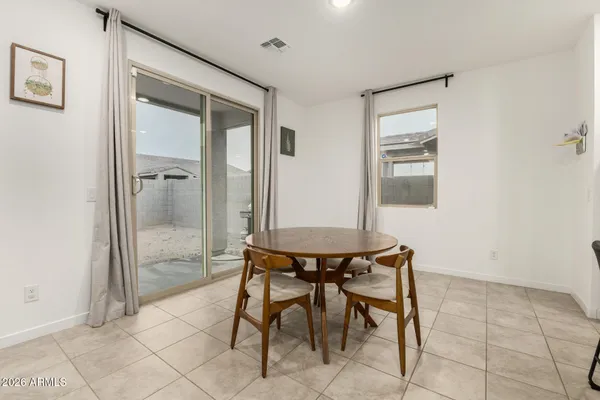 a view of a room with furniture and wooden floor