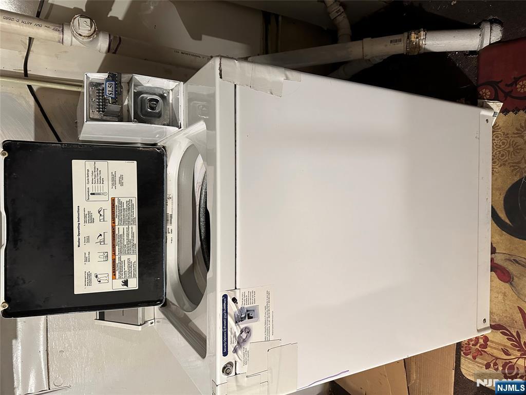 122-124 Buffalo Avenue, Unit 4 Paterson, NJ 07503 - Photo 14 of 14 a utility room with dryer and washer