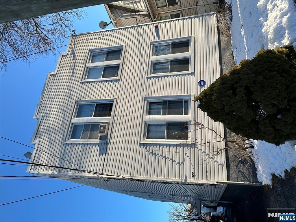 122-124 Buffalo Avenue, Unit 4 Paterson, NJ 07503 - Photo 2 of 14 a view of a house with a yard