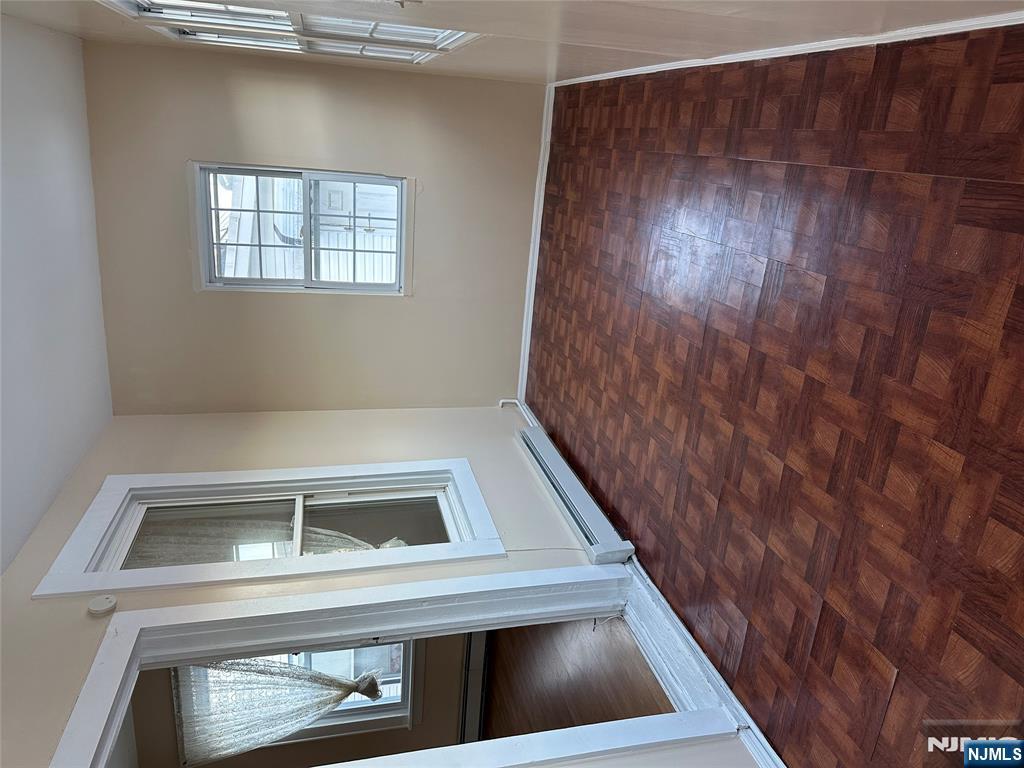 122-124 Buffalo Avenue, Unit 4 Paterson, NJ 07503 - Photo 3 of 14 an empty room with windows