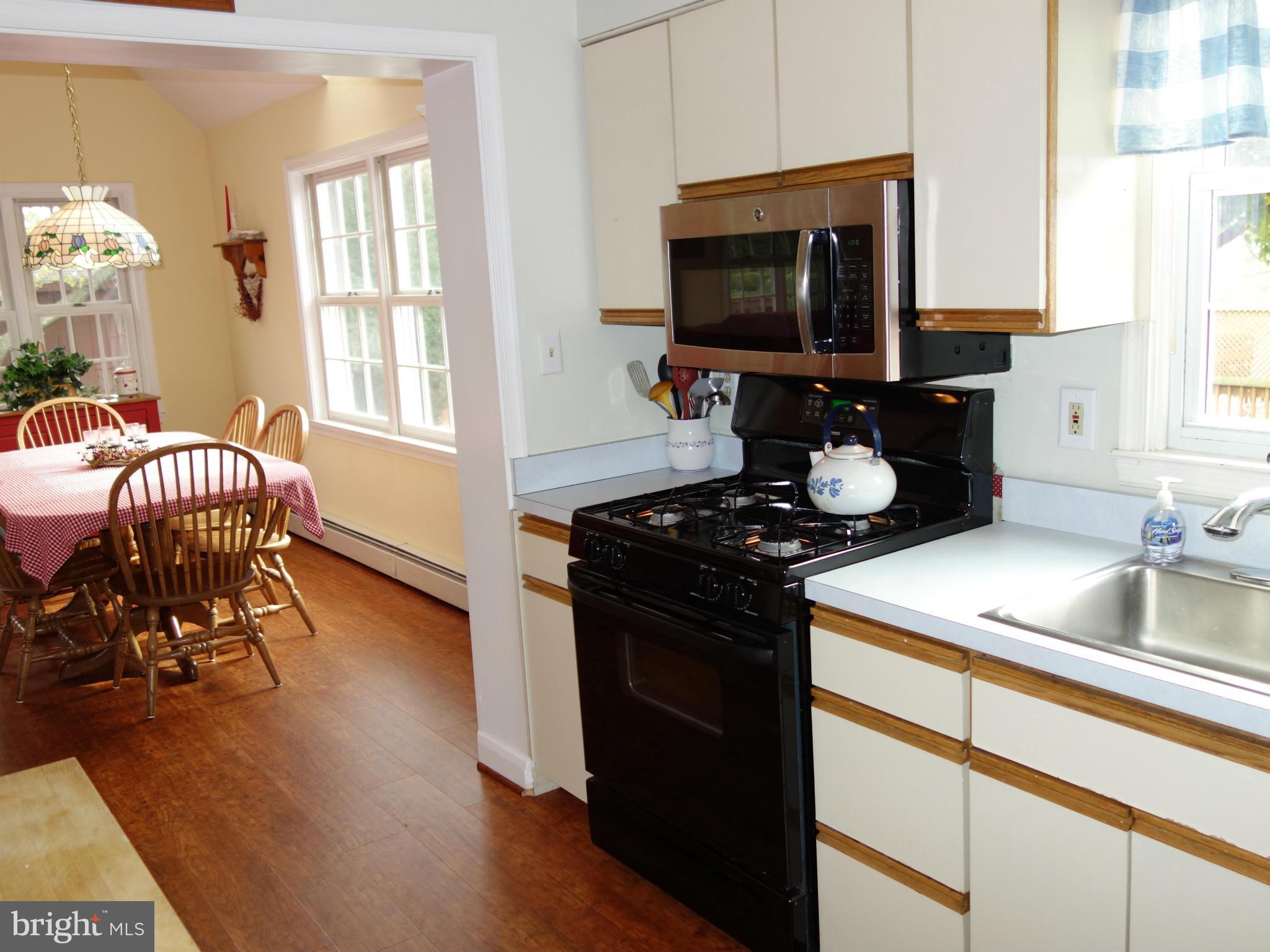 407 Gralan Road Catonsville, MD 21228 - Photo 5 of 30 Kitchen and Breakfast Area with new flooring