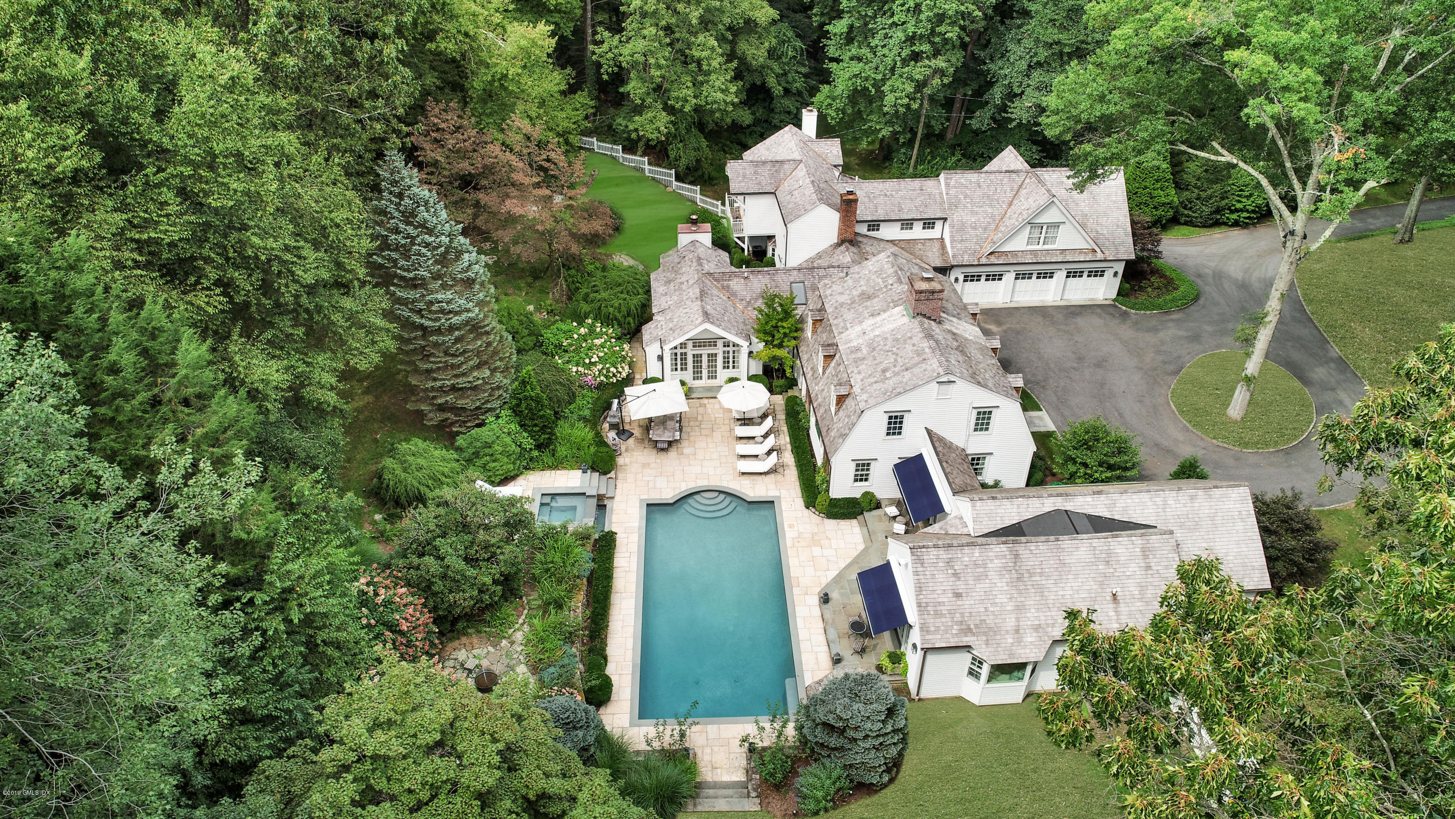 an aerial view of a house with outdoor space