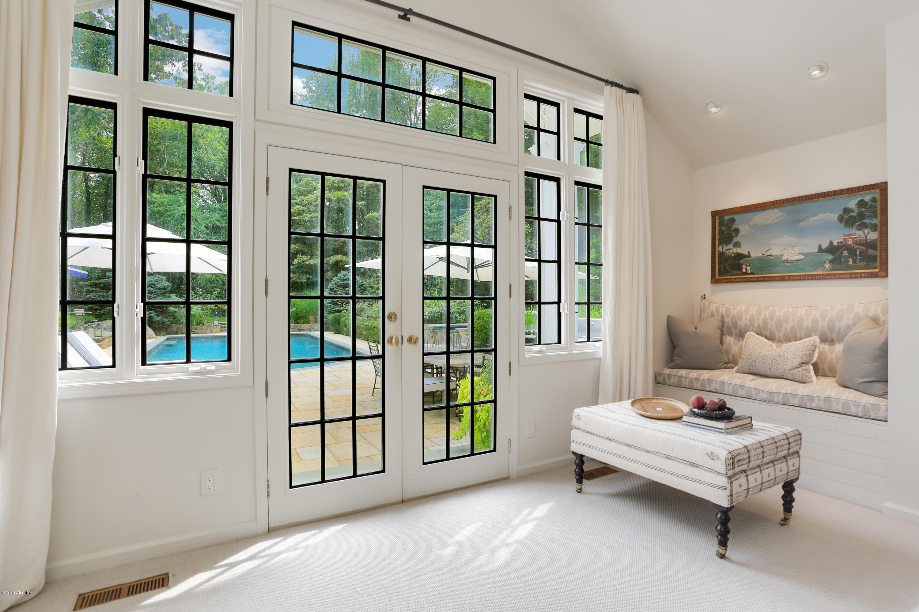 418 Riversville Road Greenwich, CT 06831 - Photo 12 of 38 a bedroom with a bed and a large window