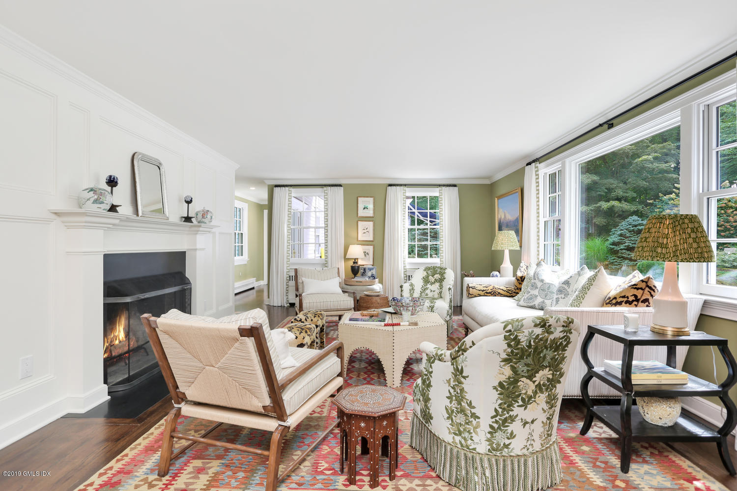 418 Riversville Road Greenwich, CT 06831 - Photo 14 of 38 a living room with furniture and a fireplace