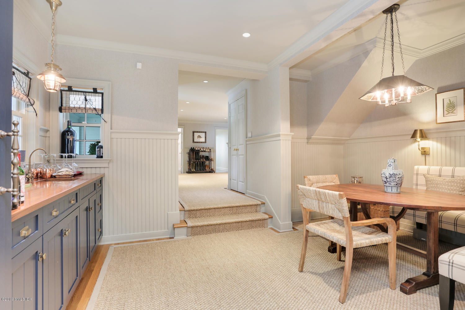 418 Riversville Road Greenwich, CT 06831 - Photo 20 of 38 a view of a kitchen with dining table and chairs
