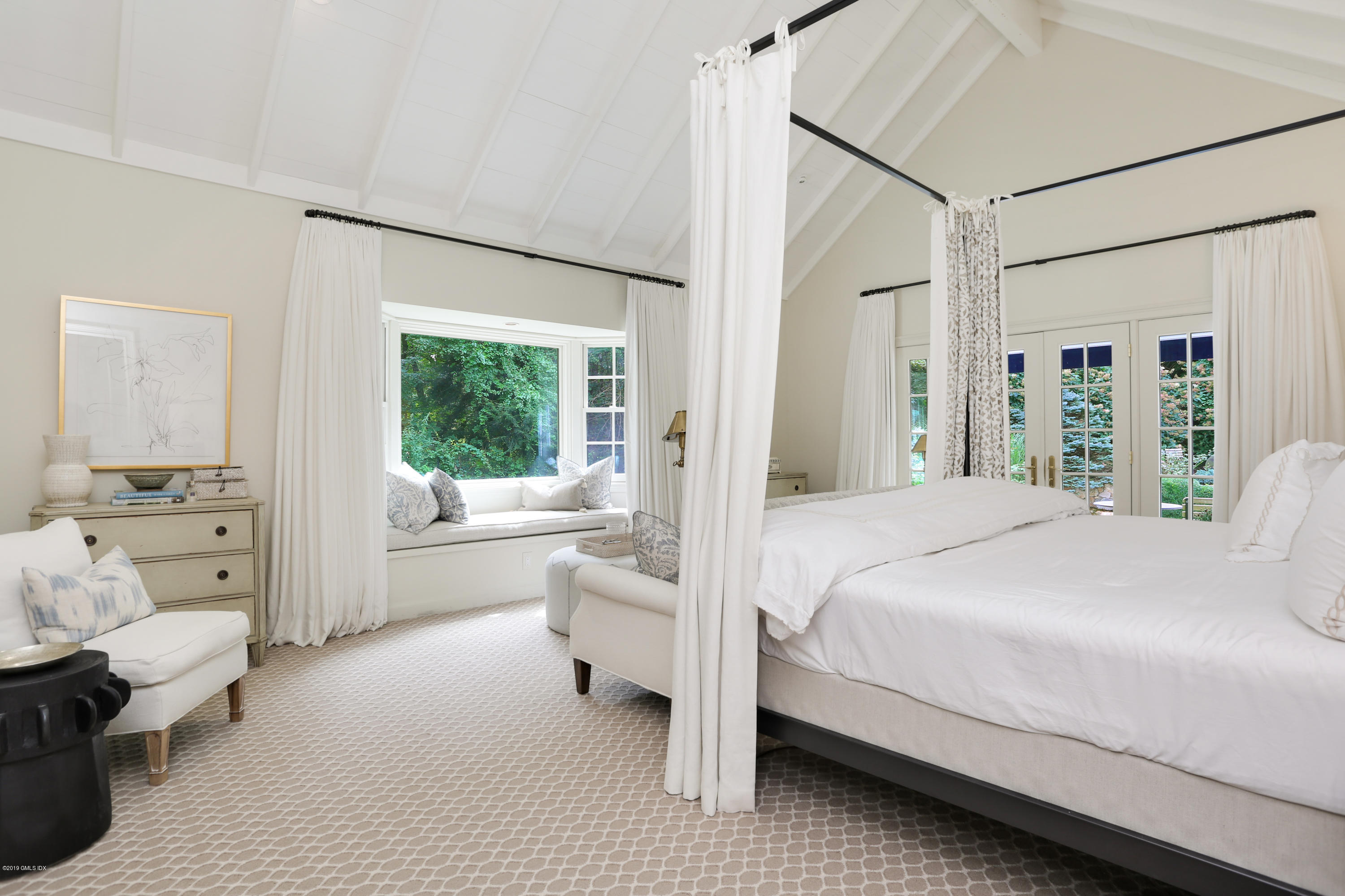 418 Riversville Road Greenwich, CT 06831 - Photo 22 of 38 a bedroom with a bed and a large window