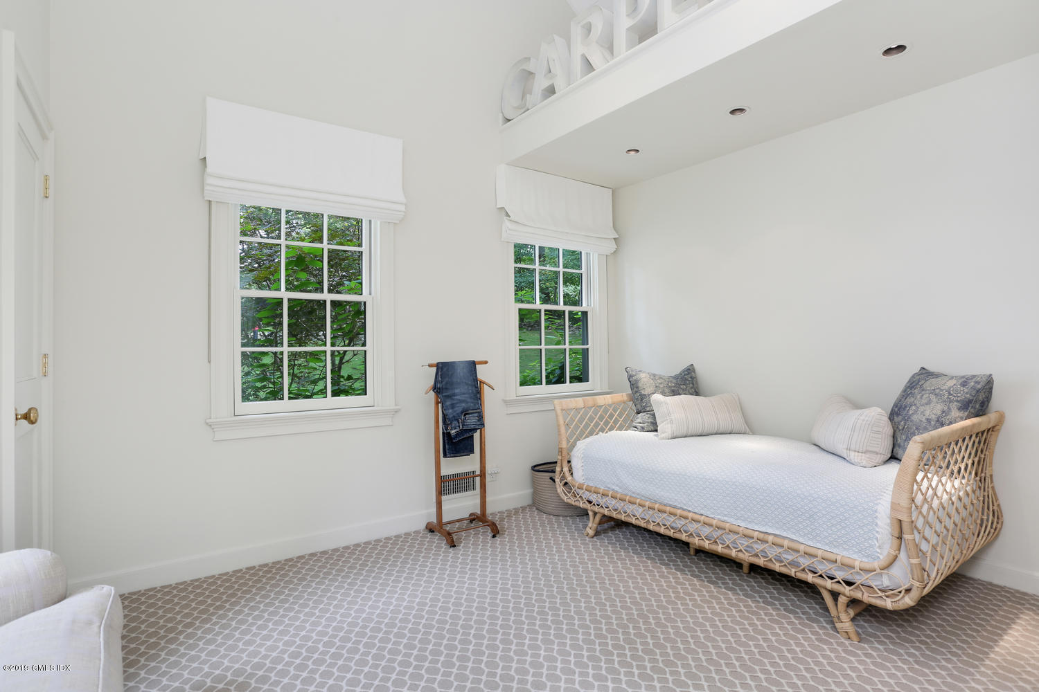 418 Riversville Road Greenwich, CT 06831 - Photo 25 of 38 a bedroom with a bed and a window