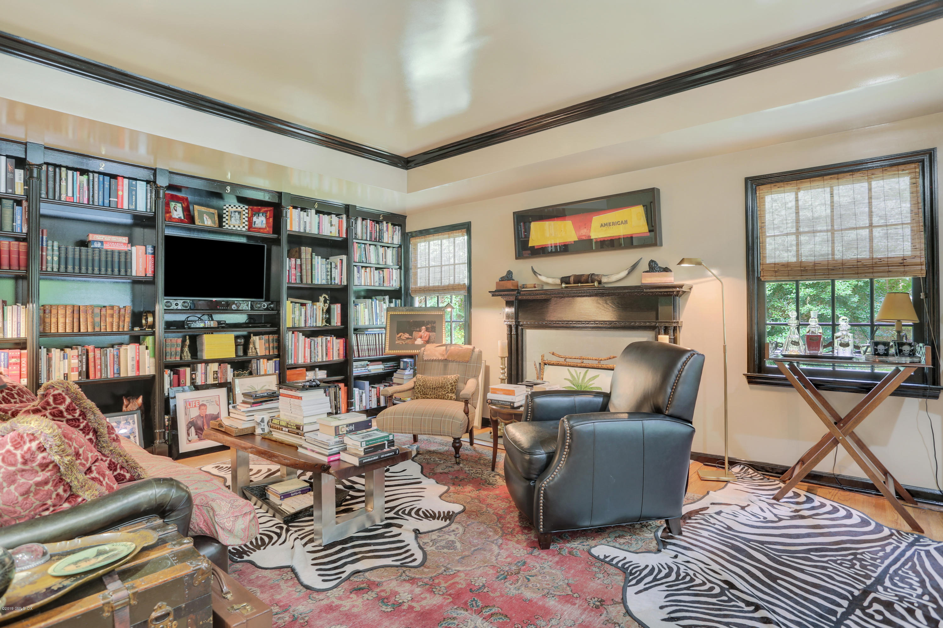 418 Riversville Road Greenwich, CT 06831 - Photo 31 of 38 a living room with furniture and a flat screen tv