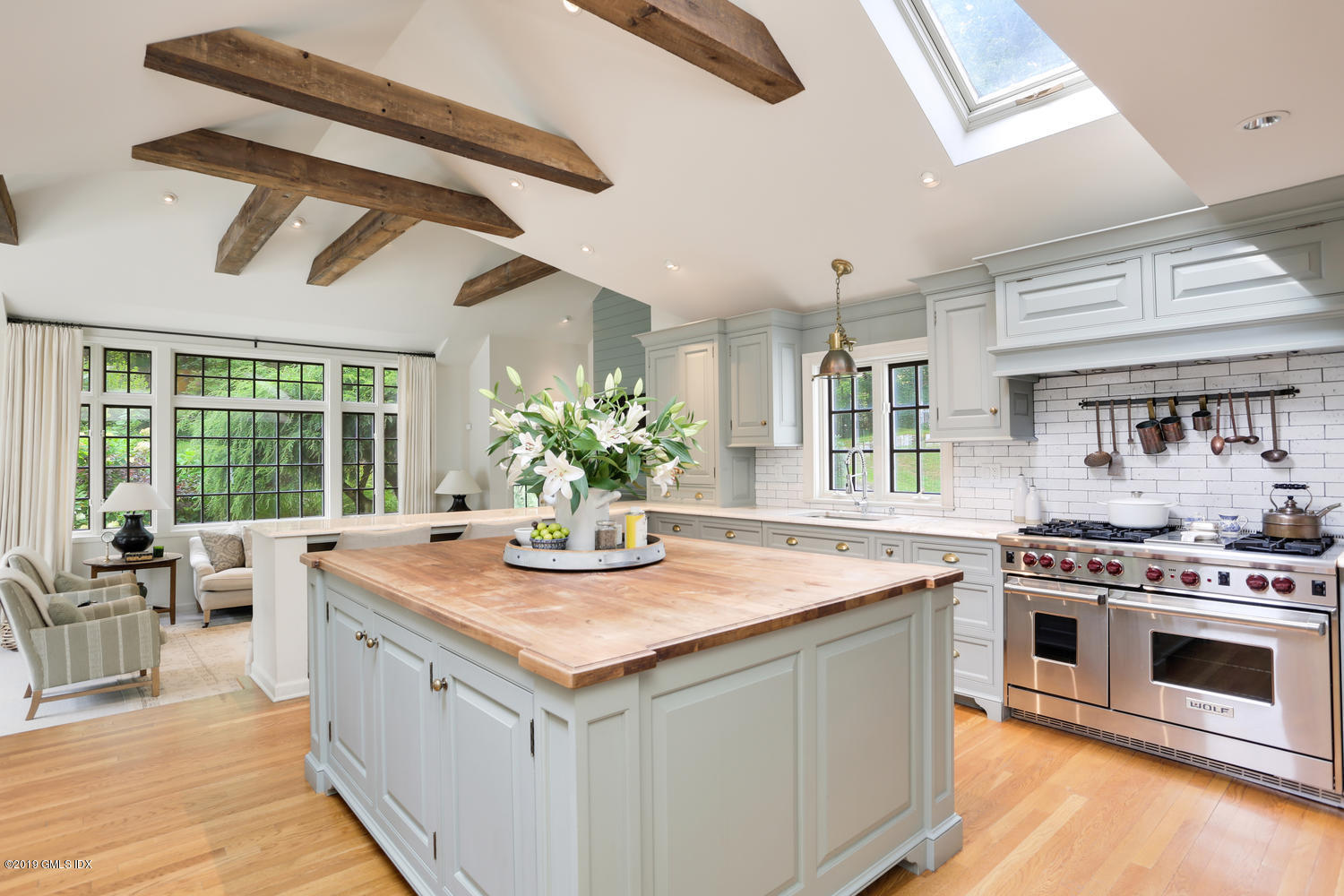 418 Riversville Road Greenwich, CT 06831 - Photo 7 of 38 a kitchen with a stove and a wooden floor